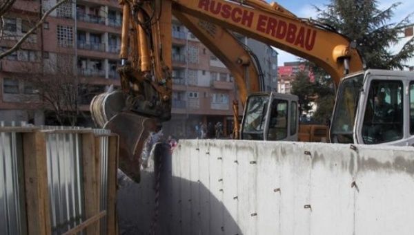 Bulldozers demolish a wall following weeks of tensions between Kosovo and Serbia, in the ethnically divided town of Mitrovica, Kosovo, Feb. 5, 2017.