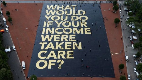 A large poster in a square in Geneva, Switzerland, promoting the idea of a universal basic income