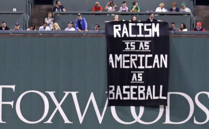 Racism is as American as baseball' banner unfurled over Fenway