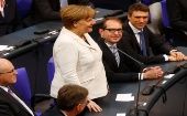 364 votos, entre conservadores y socialdemócratas, otorgan a Angela Merkel un cuarto mandato.