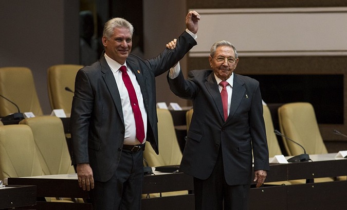 Cuba's new President Miguel Diaz-Canel stands at the country's National Assmely with former President Raul Castro.